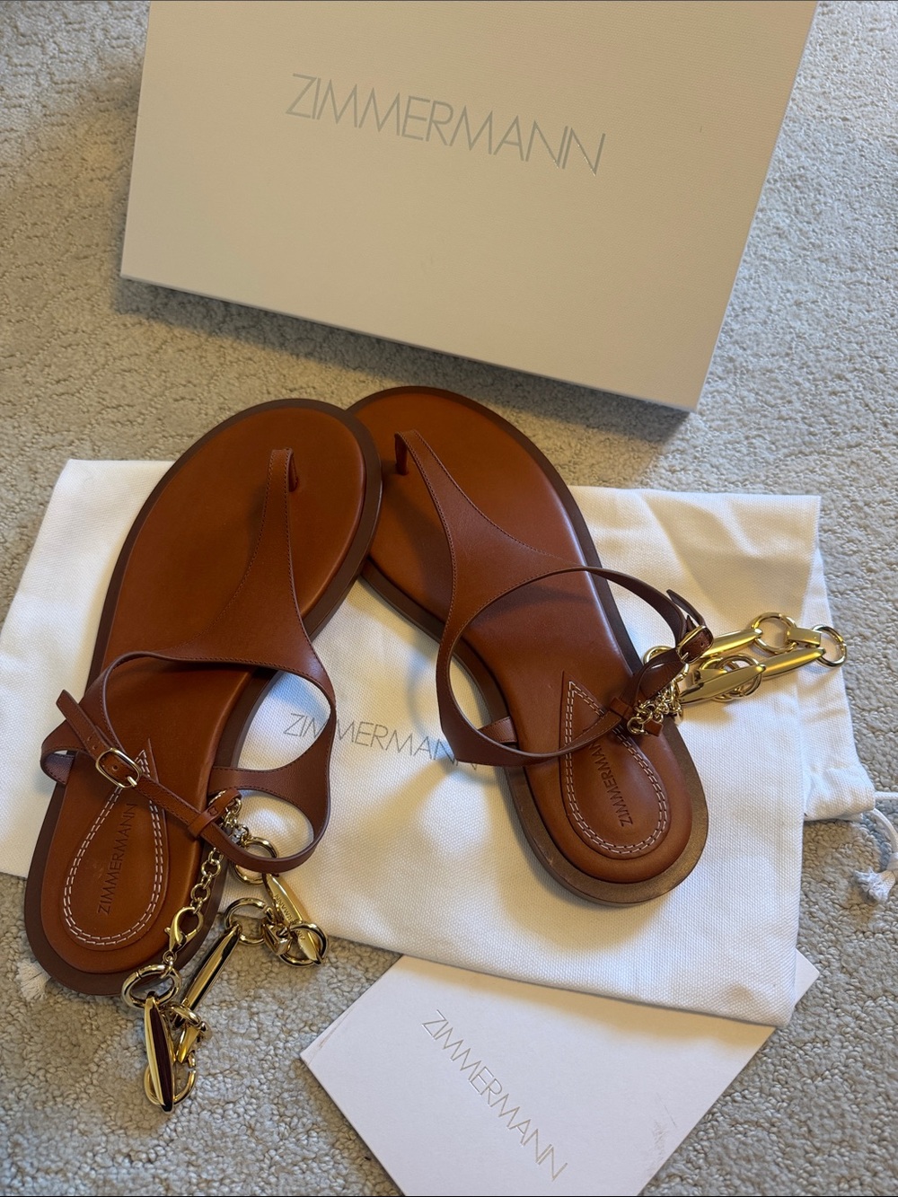 Zimmermann Cognac Leather T‑Bar Sandals with Gold Chain Trim
